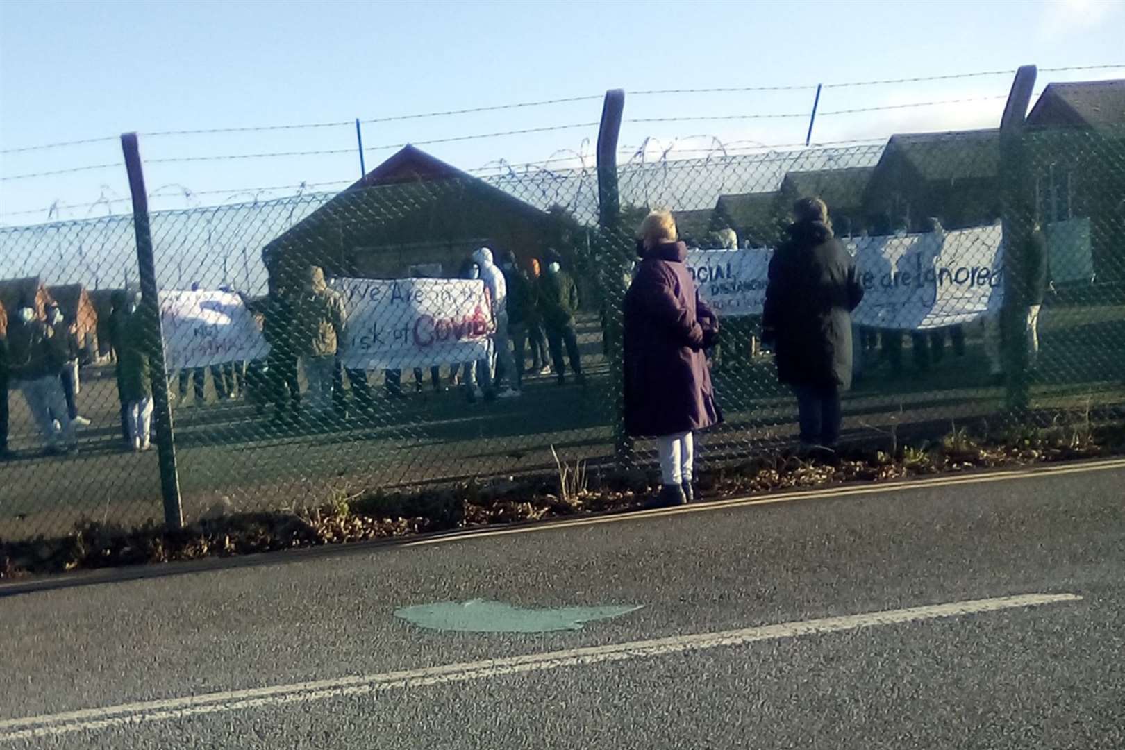 People seeking asylum protesting at Napier Barracks