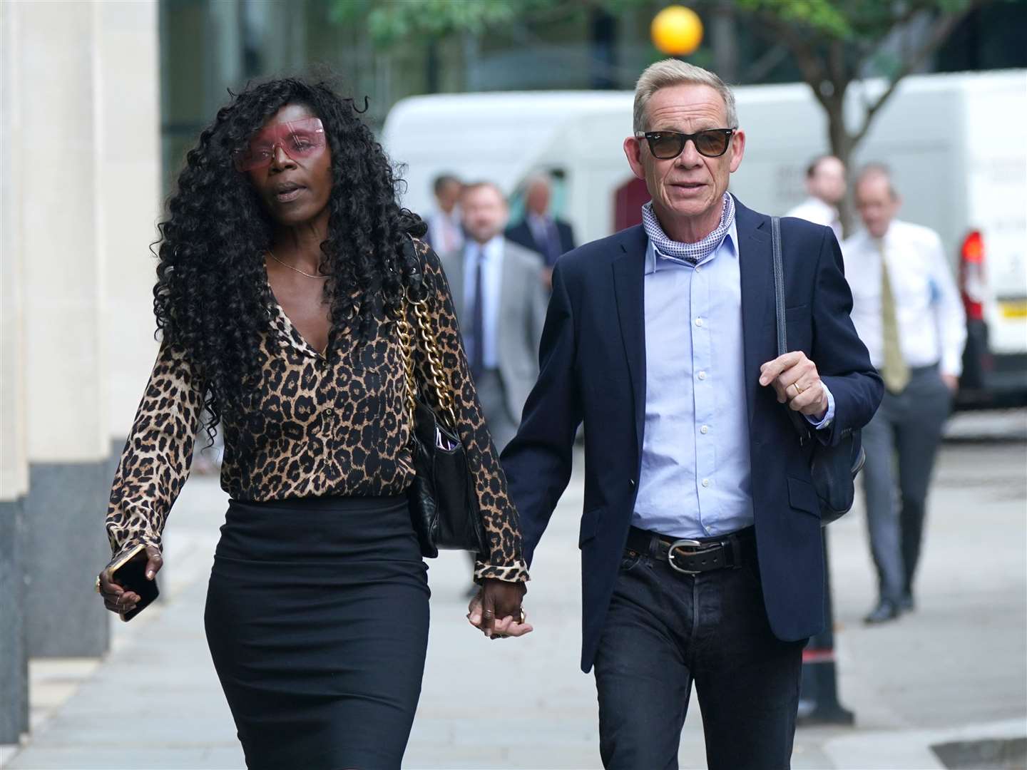 Paul Cook arrives at the Rolls Building at the High Court in London with his wife Jeni (Yui Mok/PA)