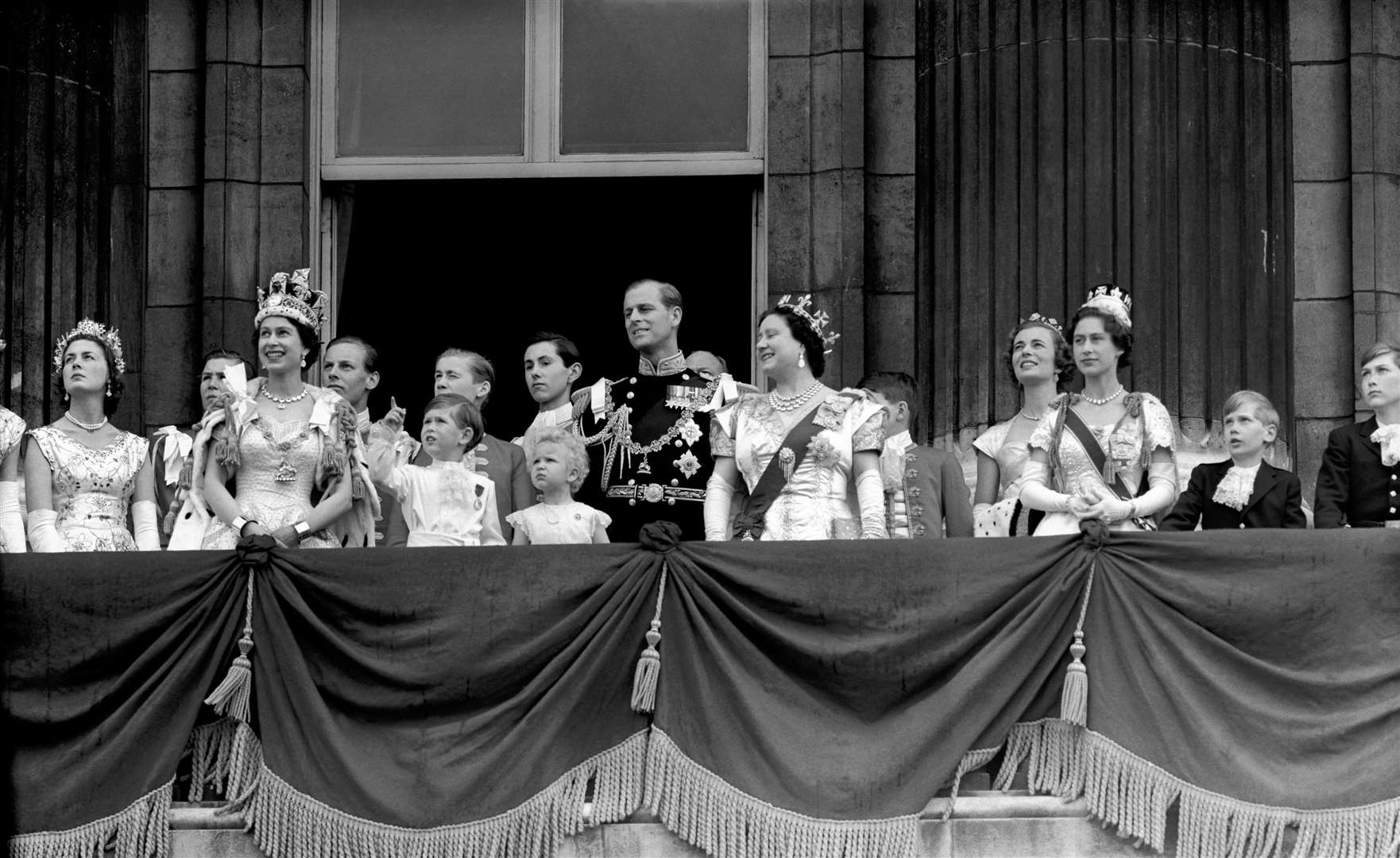 Charles points to the planes during the coronation flypast (PA)