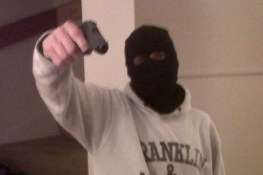 Robber shown on 'selfie' posing with handgun