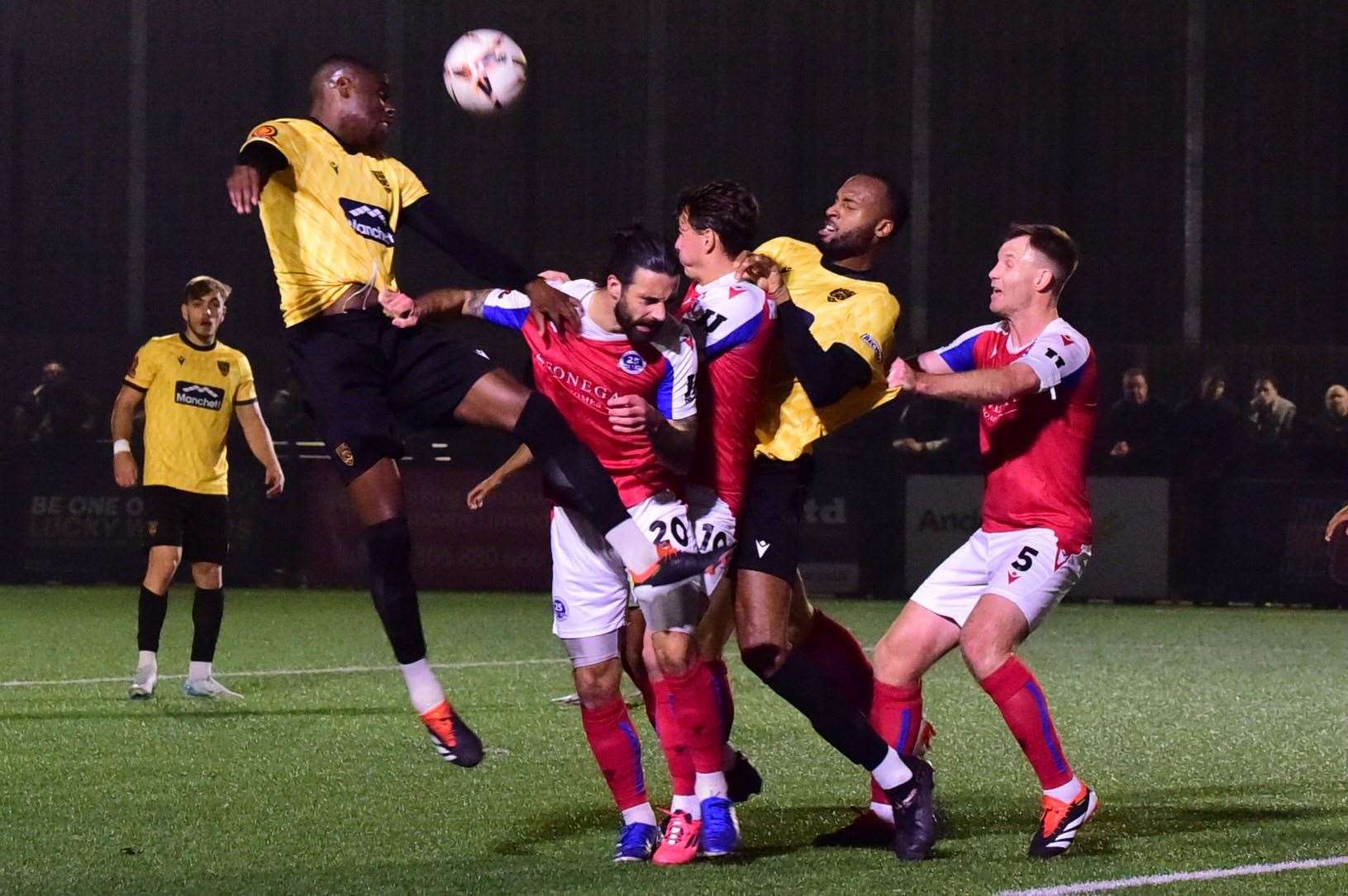 Maidstone defender Temi Eweka wins a header. Picture: Steve Terrell