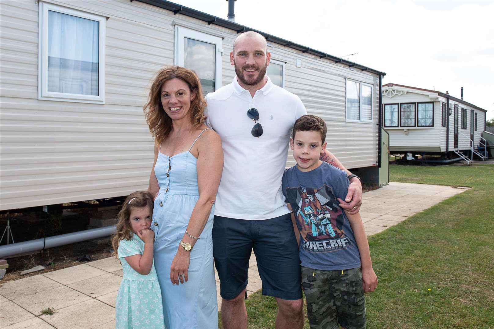 Rosie, Emma, Dean and Euan Giles outside the caravan