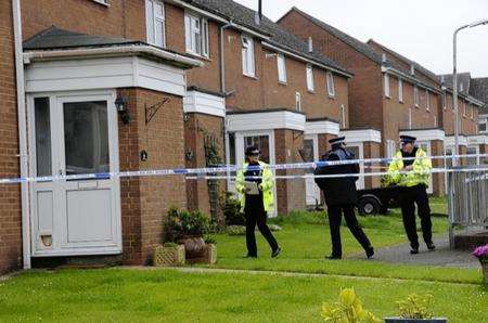 Police at the house where a woman's body was found in Prescott Close, Guston