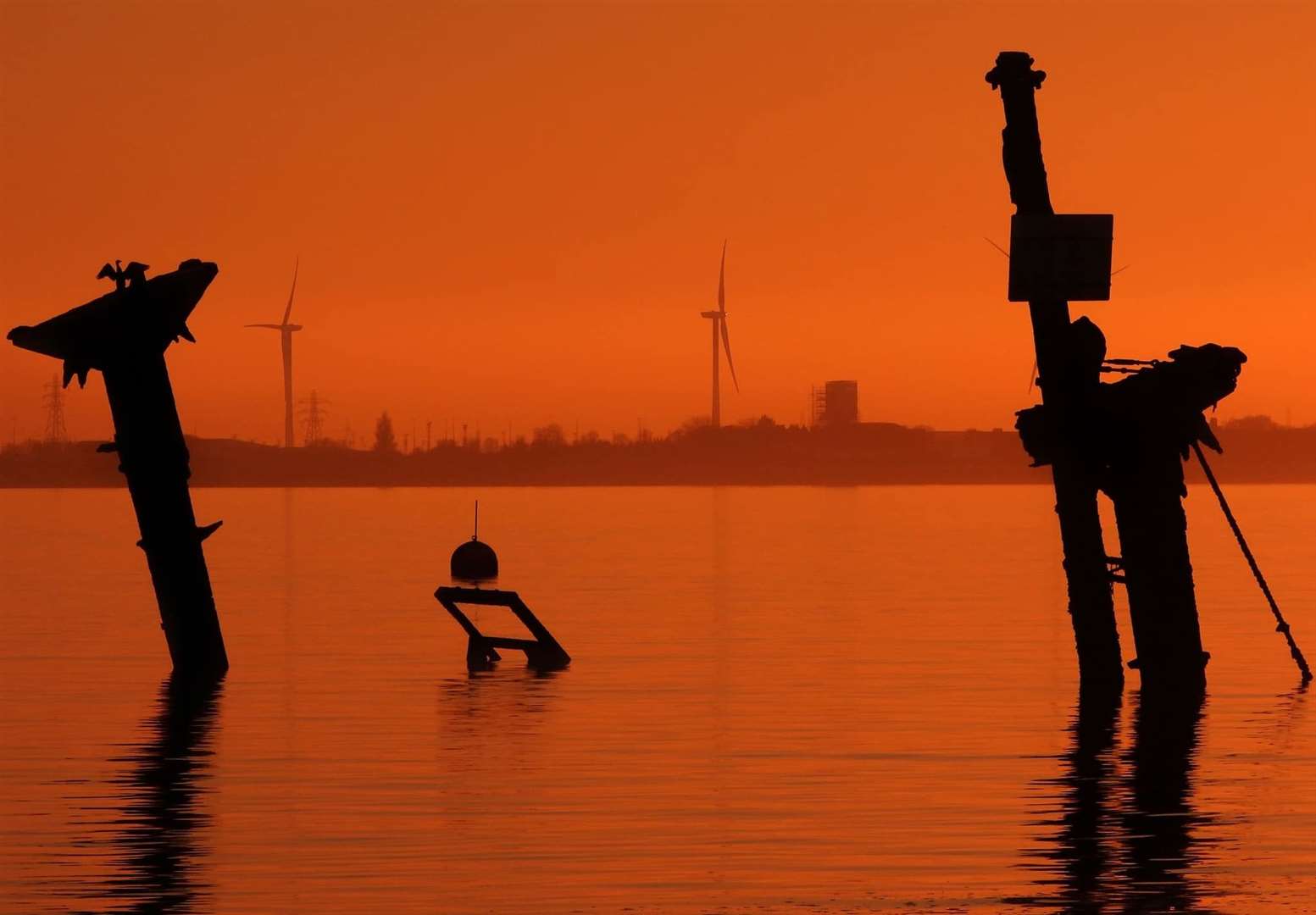 The distinctive masts of the SS Richard Montgomery bomb ship wrecked off Sheerness captured at low tide and at sunset by Margaret Flo McEwan (54309557)