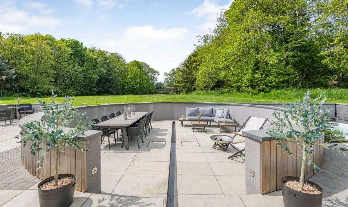The stylish seating area on the terrace is the centrepiece of the garden. Picture: Strutt & Parker