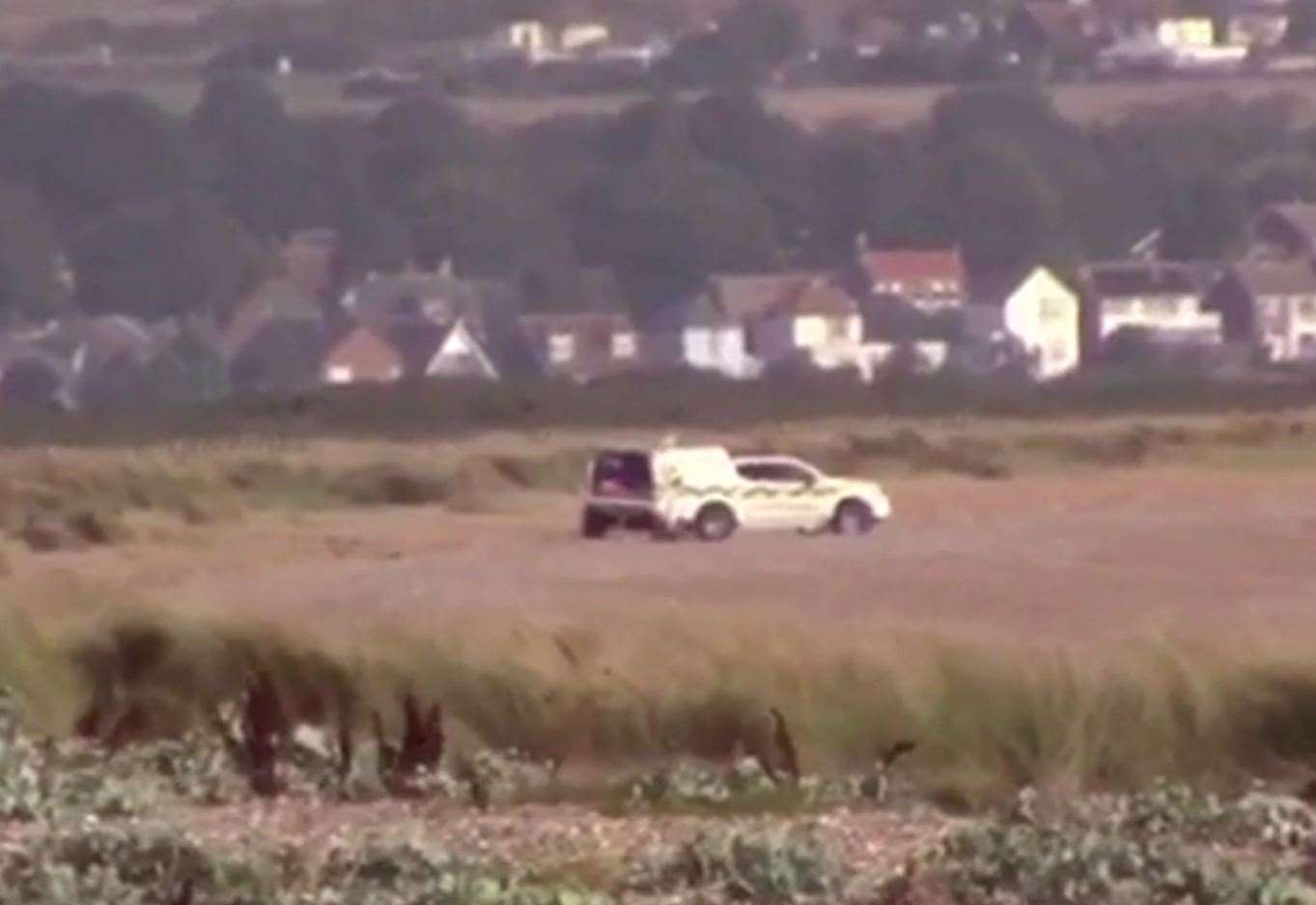 Footage taken on Saturday morning showed an emergency vehicle parked on the beach. Picture from video by Chris Johnson