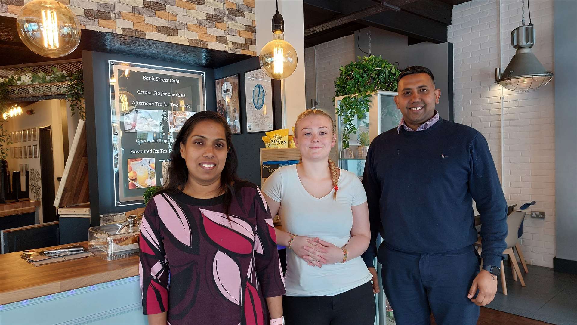 Gloriya and Jeevan Coultan with employee Tory Stephens