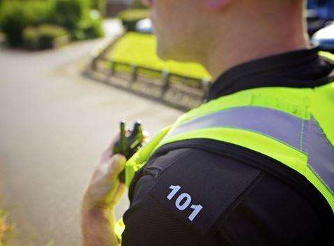 Police officer with walkie talkie. Stock picture (863413)