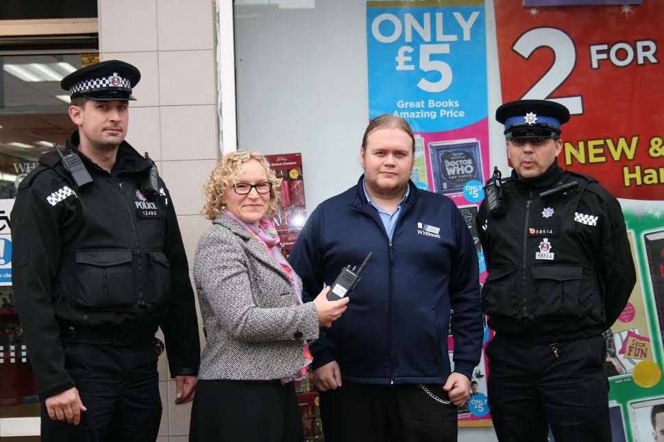 Simon Weeks from WHSmith, second from right, is equipped with a walkie-talkie by Jenney Bravery of Swale Safe