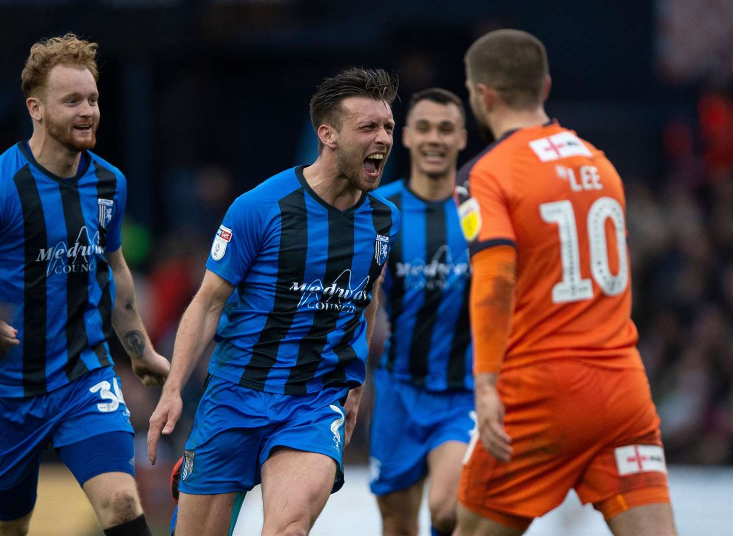 Luke O'Neill celebrates his free-kick equaliser for Gillingham Picture: Ady Kerry