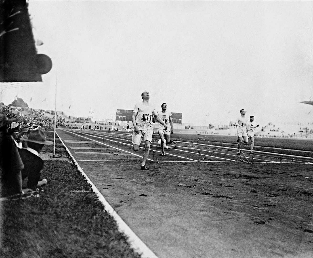 Eric Liddell crosses the line first to win 400m gold in 1924 (PA)