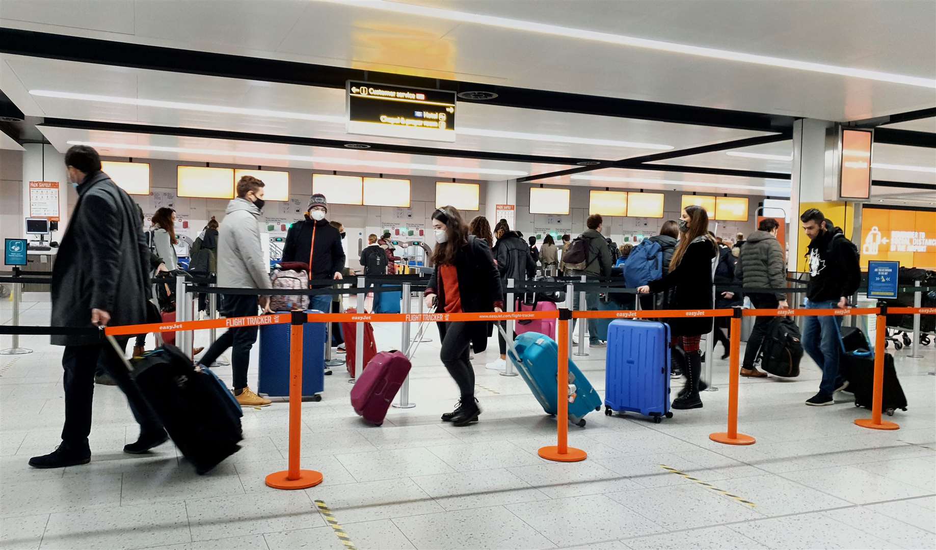 Passengers queue for check-in at Gatwick Airport (Gareth Fuller/PA)