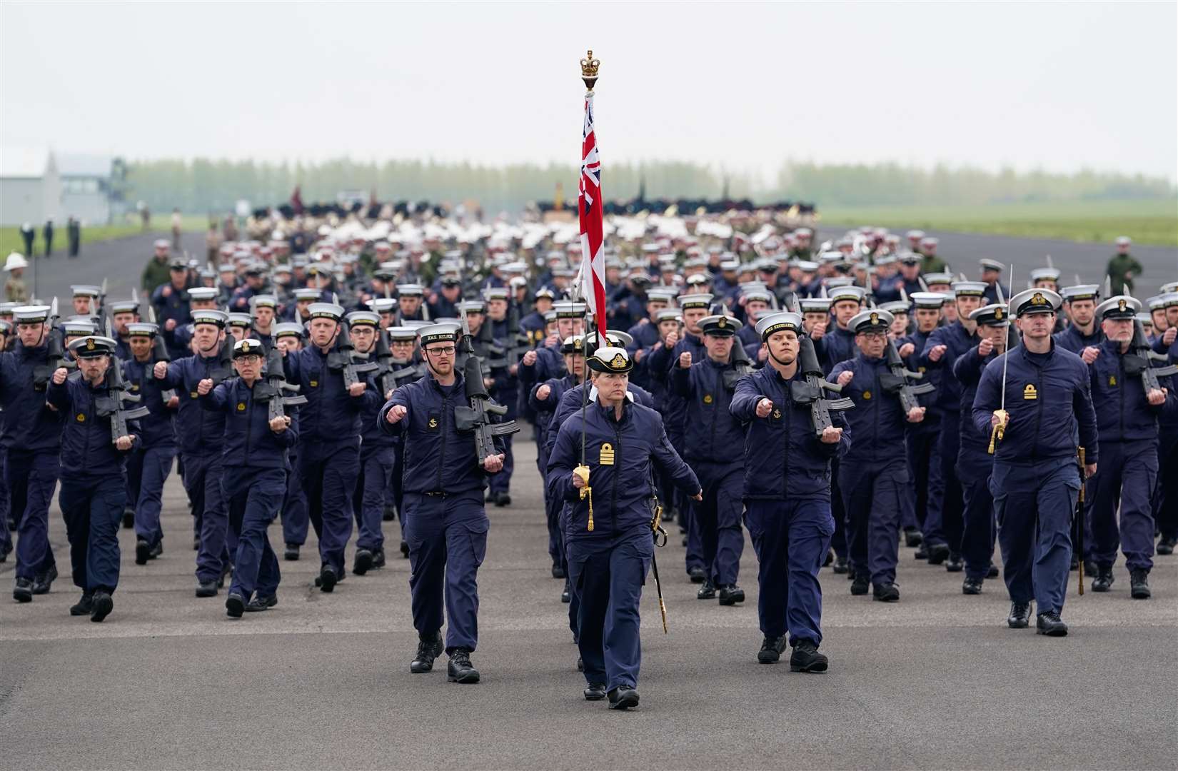 Members of the Royal Navy march during a full tri-service and Commonwealth rehearsal at RAF Odiham in Hampshire (Andrew Matthews/PA)