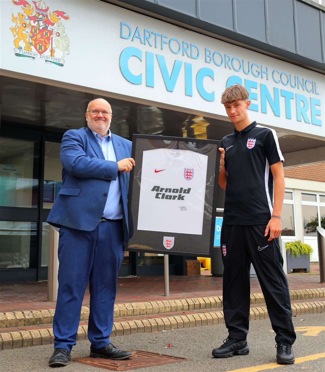 Toby Nelson presents council leader Jeremy Kite with one of his signed England shirts. Picture: Dartford Borough Council