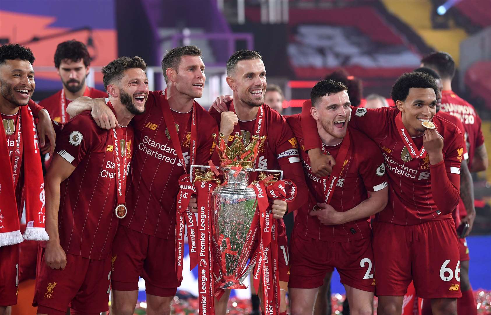 Andy Robertson (second from right) celebrates winning the English Premier League with his Liverpool teammates (Laurence Griffiths/PA)