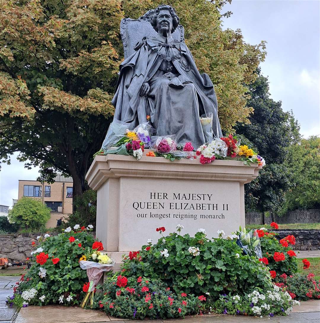 Residents have placed flowers on the Queen Elizabeth II statue in St Andrew's Gardens, Gravesend