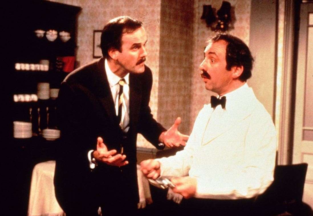 John Cleese as Basil Fawlty and Andrew Sachs as Manuel in Fawlty Towers Picture: BBC