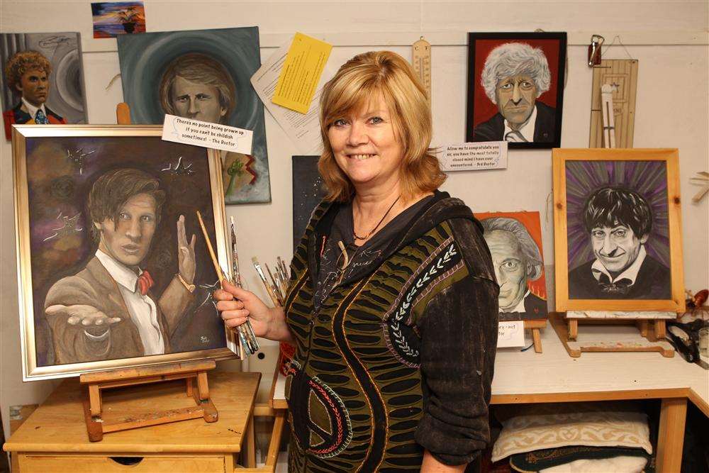 Artist Nikki Baker with some of her paintings of Dr Who at her house in Sittingbourne