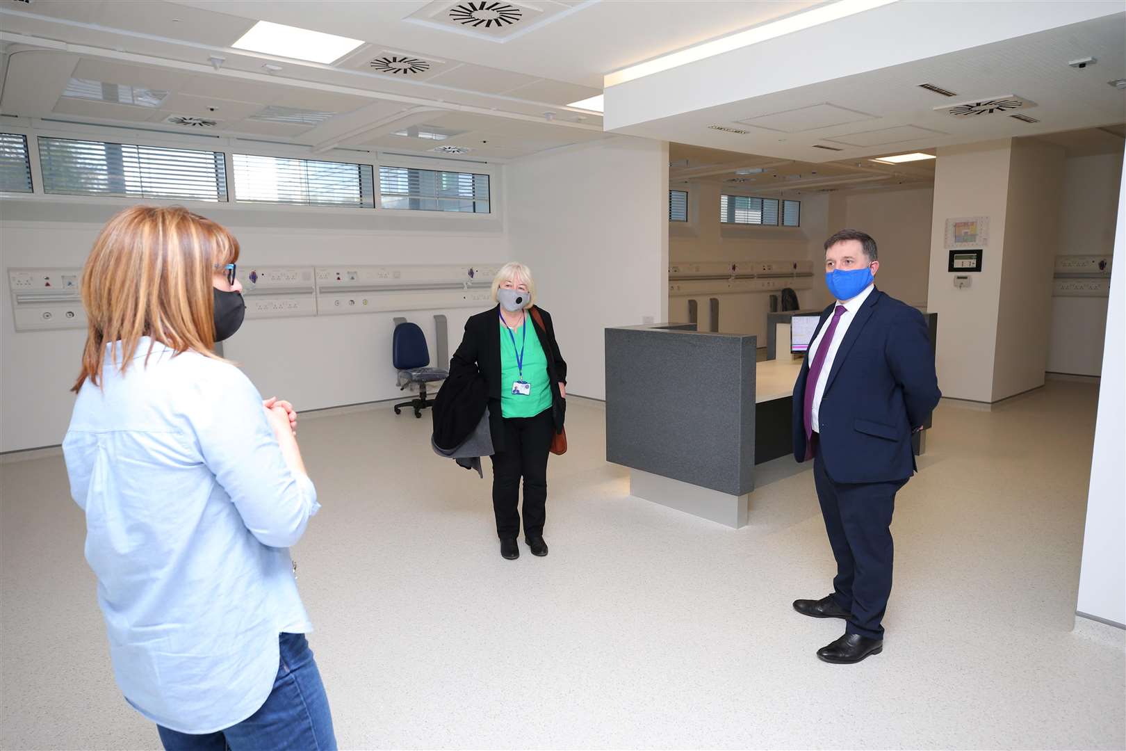 Robin Swann visiting a mass vaccination facility at the Ulster Hospital (Presseye/PA)