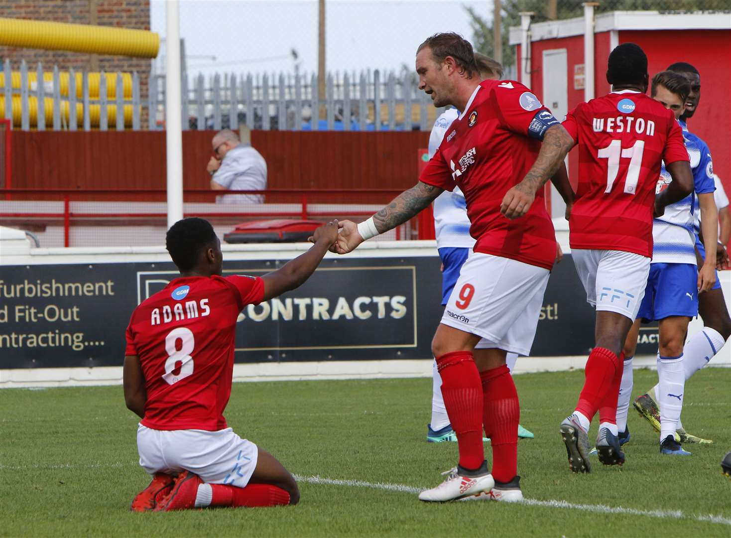 Danny Kedwell gives Ebou Adams a helping hand Picture: Andy Jones