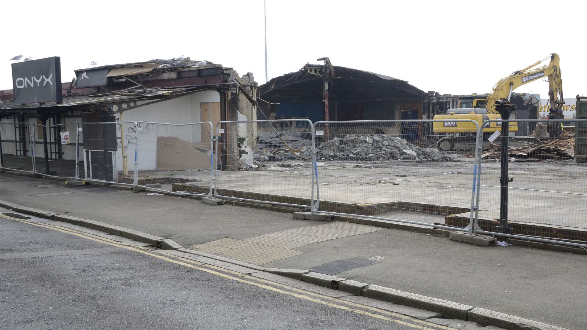 Demolition diggers moved in a month after the fire to knock down the remaining building. Picture: Paul Amos