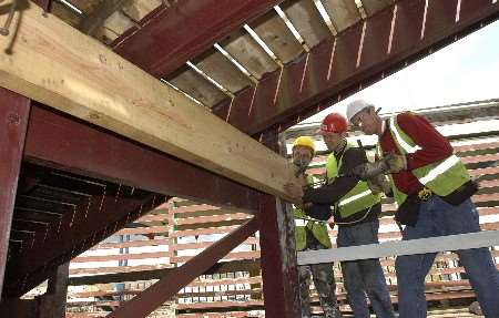 THE FUN STARTS HERE: Workers busy preparing for the opening. Picture: DAVE DOWNEY