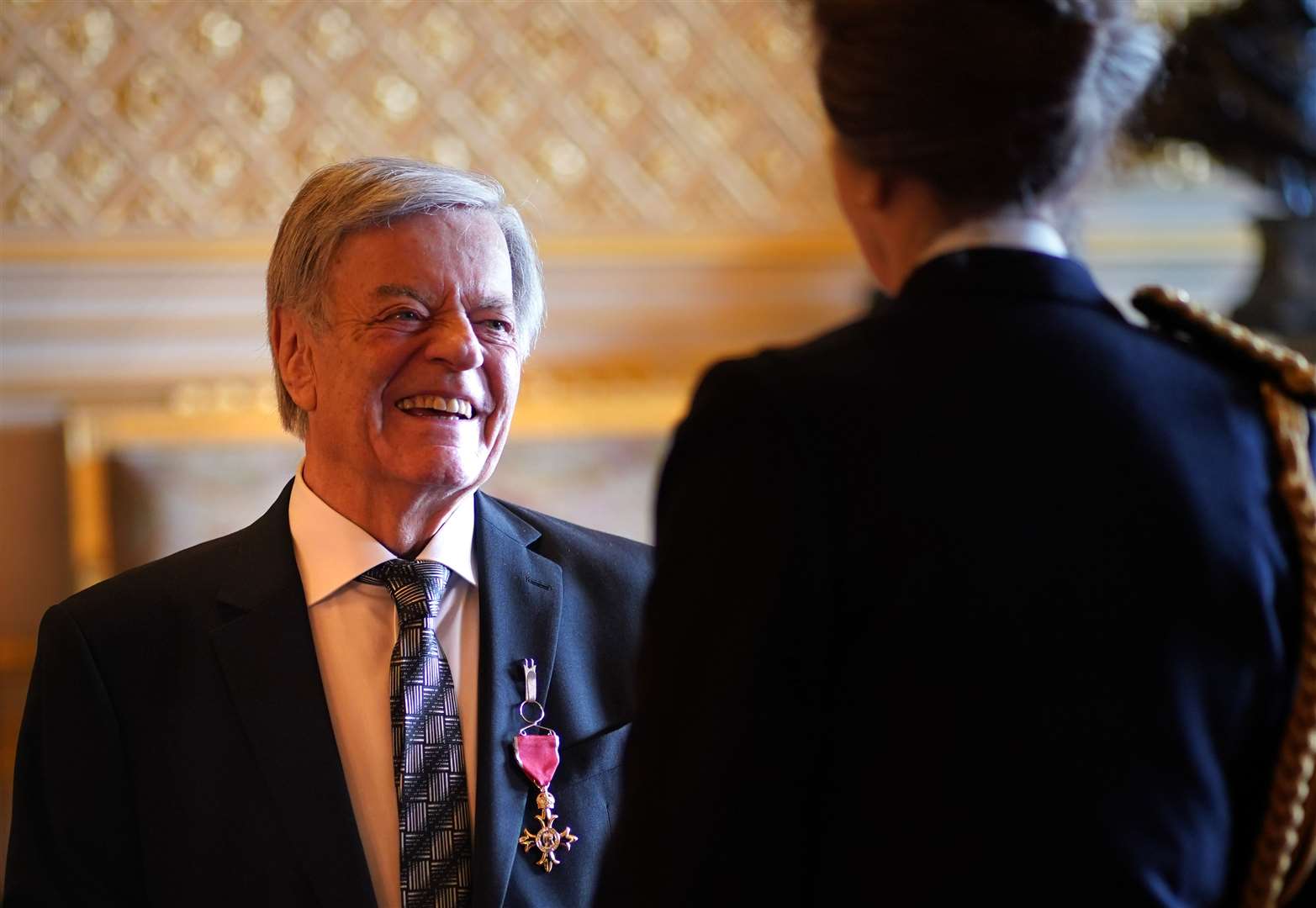 DJ Tony Blackburn is made an Officer of the Order of the British Empire by the Princess Royal at Windsor Castle. Blackburn marked 60 years in broadcasting in 2024 (Yui Mok/PA)