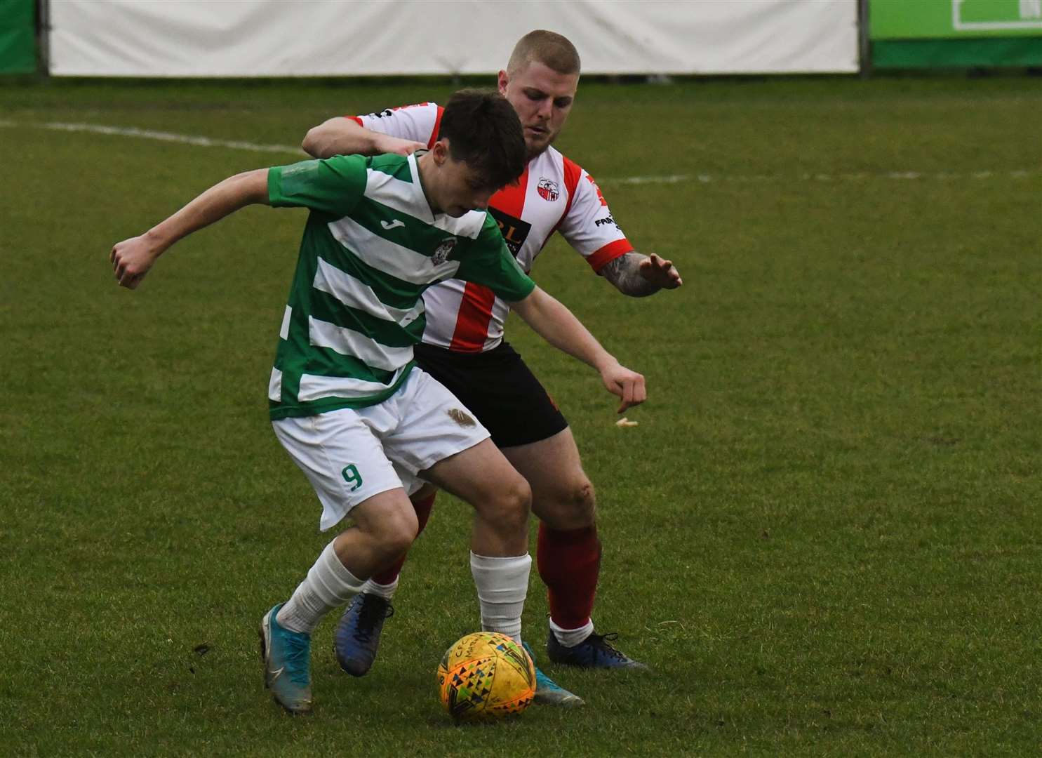 Defender Dan Birch puts in a challenge as Sheppey take on Corinthian Picture: Marc Richards