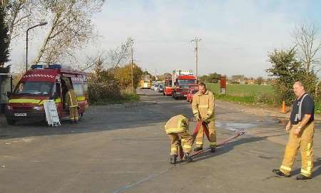 Firefighters working at the scene. Picture courtesy GEORGE WILSON