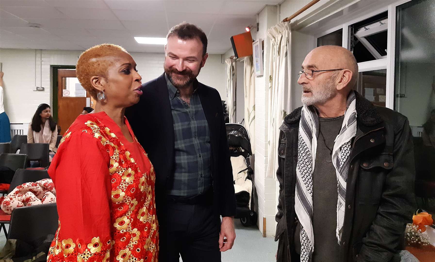 Lola Oyewusi, Alex Patterson and Peter Reeds talking at the exhibition