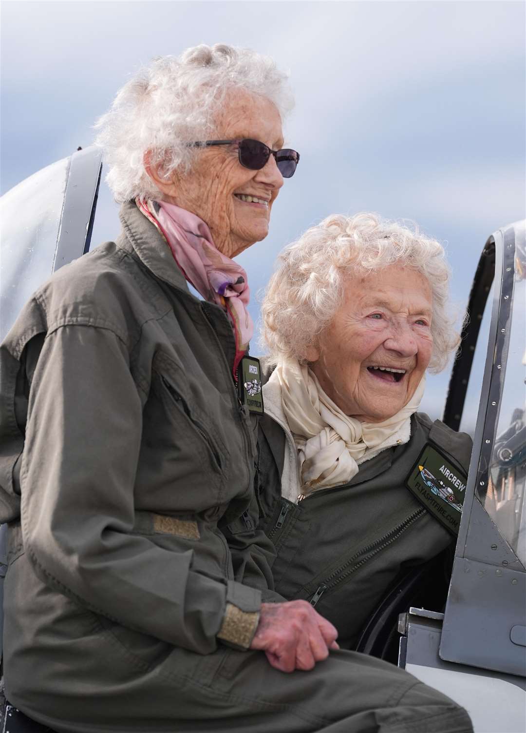 Robbie Hall and Dorothea Barron pose next to a Spitfire (Gareth Fuller/PA)