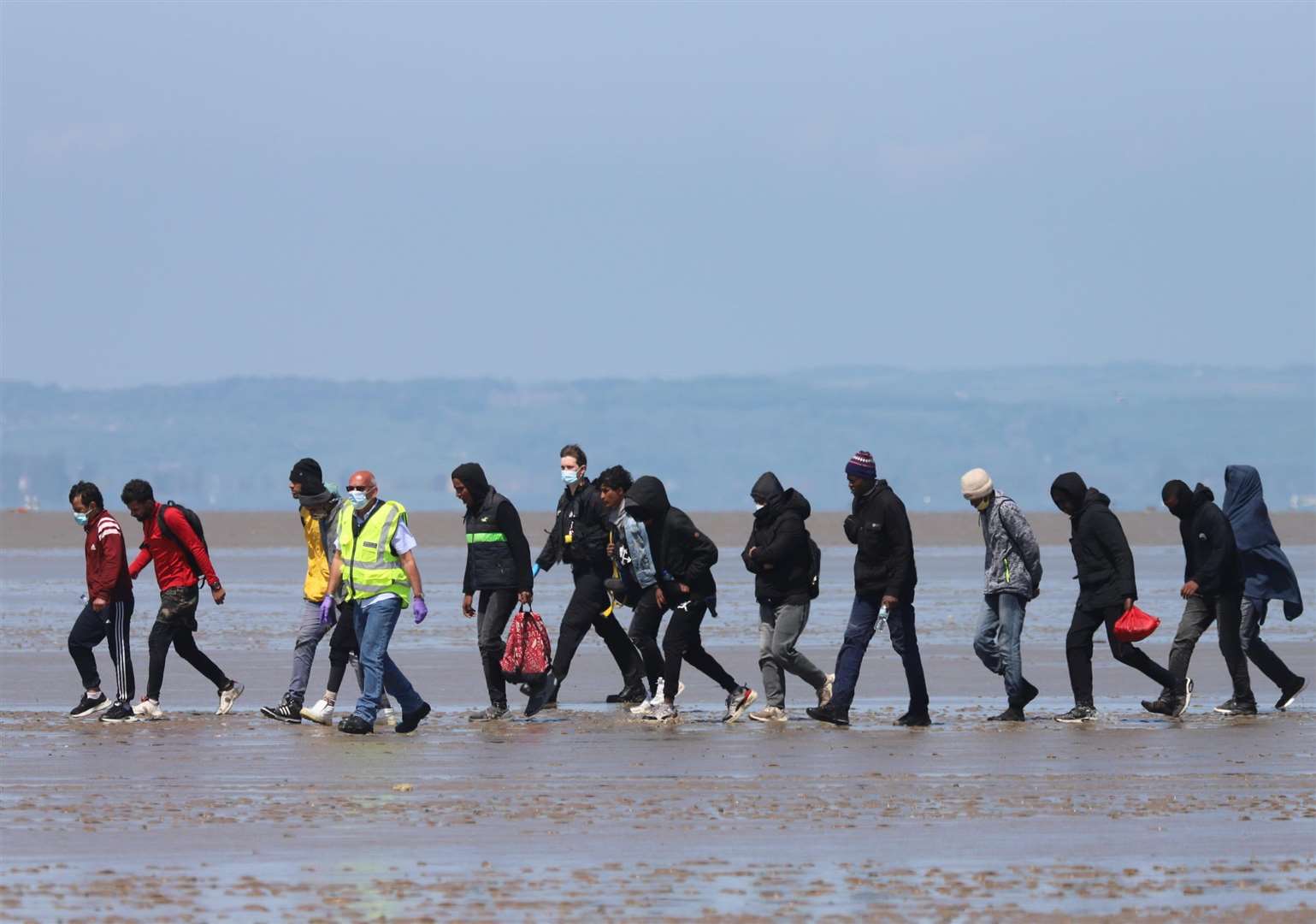 12 asylum seekers with two officials at Romney Marsh in 2021