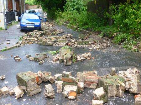 Fallen wall after flash floods in Margate.