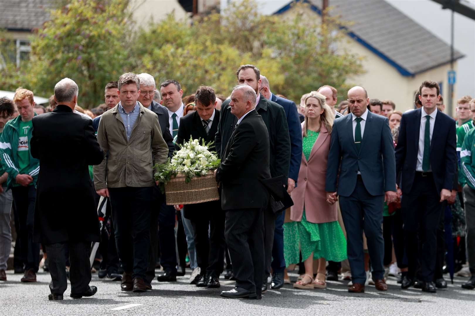 Mourners carry the coffin of Joseph Hegarty to his funeral at St Patrick’s and St Brigid’s Church, Ballycastle, Co Antrim (Liam McBurney/PA)