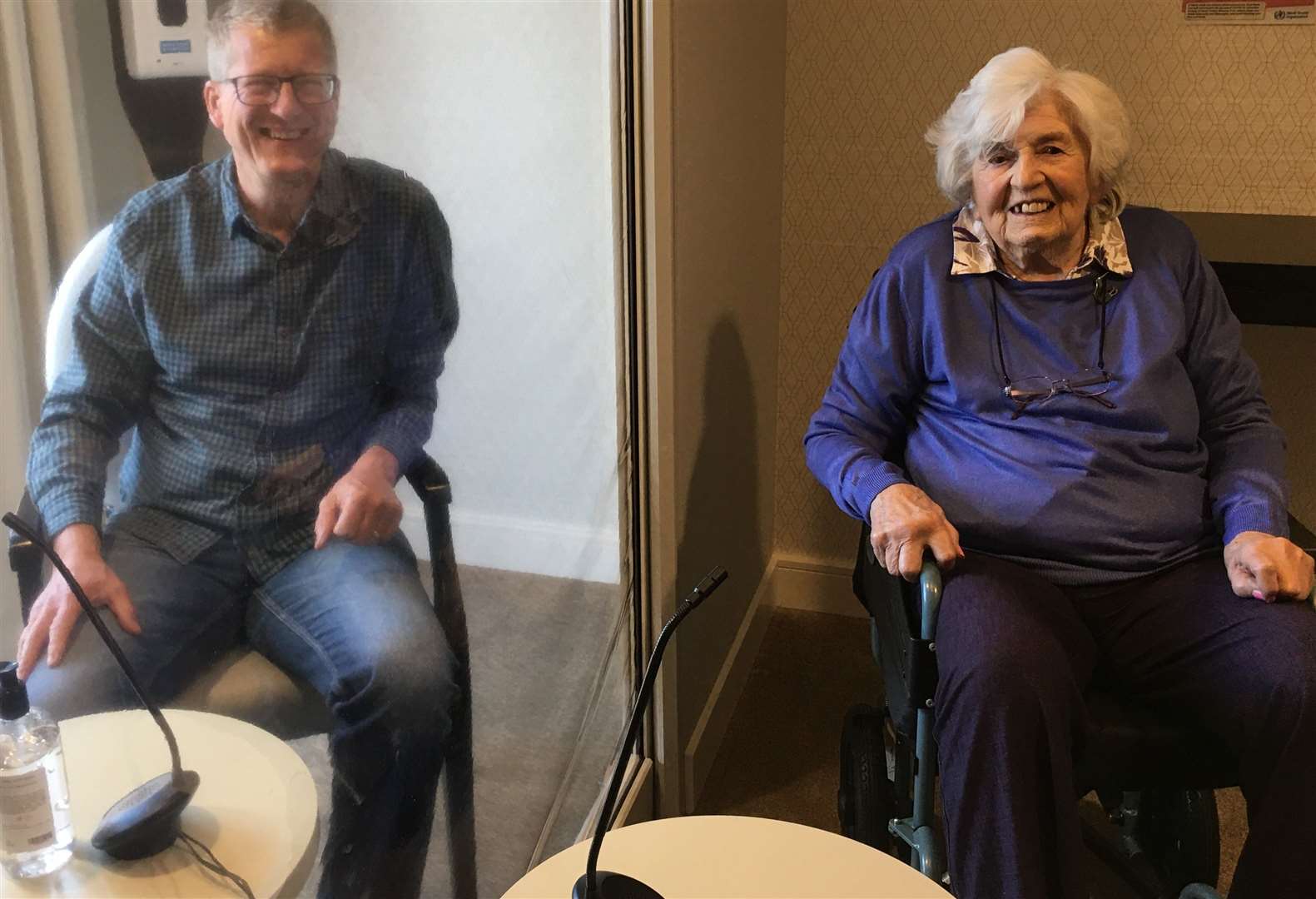 Heather Griffin and her son David Griffin meet face to face, sort of. Picture: Hamberley Care Homes