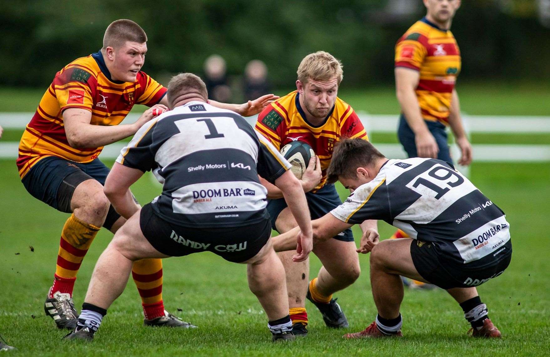 Medway's Jack Nickalls faces two Sutton & Epsom opponents, with Josh Knight in support. Picture: Jake Miles Sports Photography