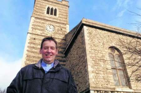 The Rev David Green outside his church