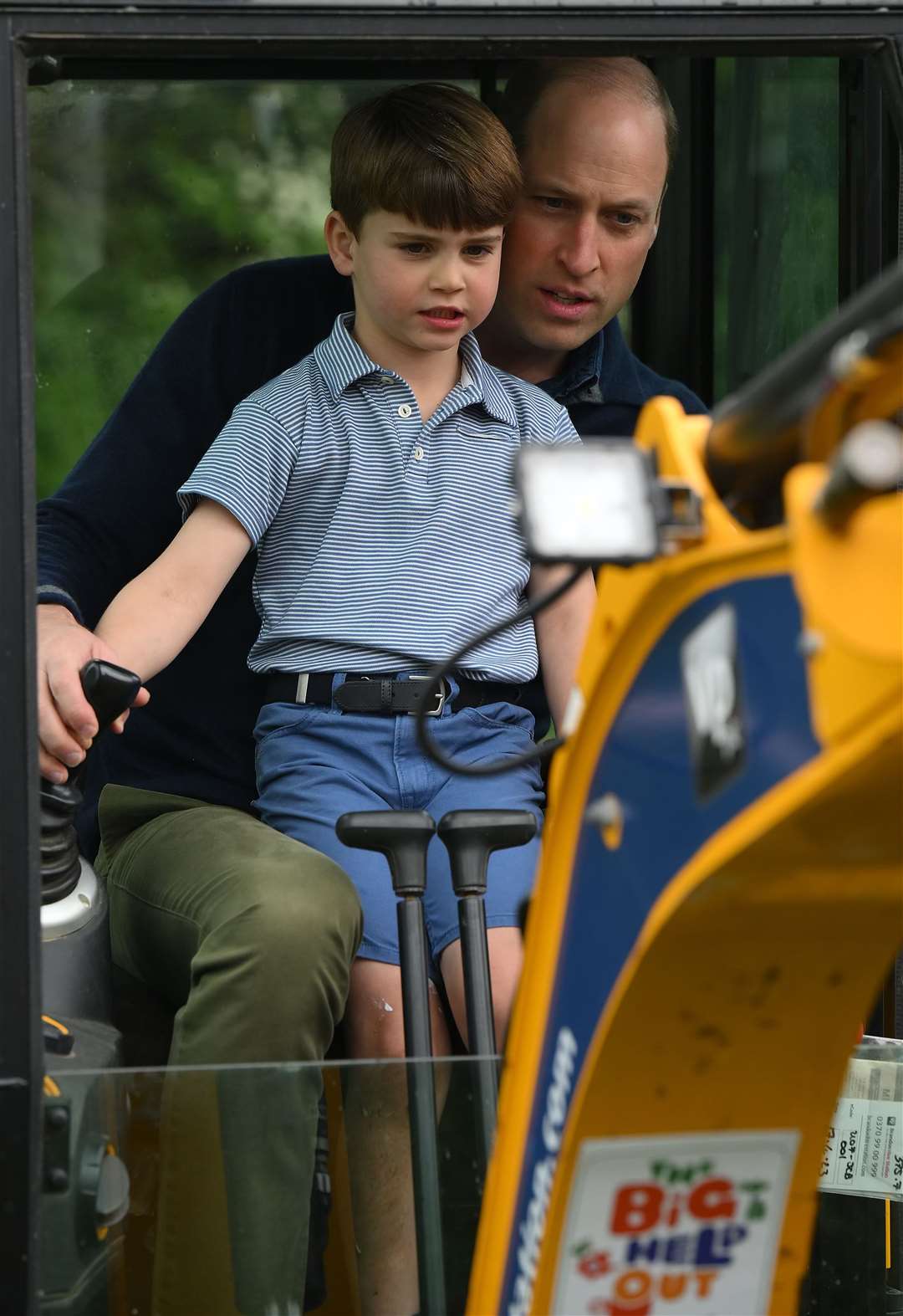 Prince Louis and the Prince of Wales join volunteers to help renovate and improve the 3rd Upton Scouts Hut in Slough (Daniel Leal/PA)