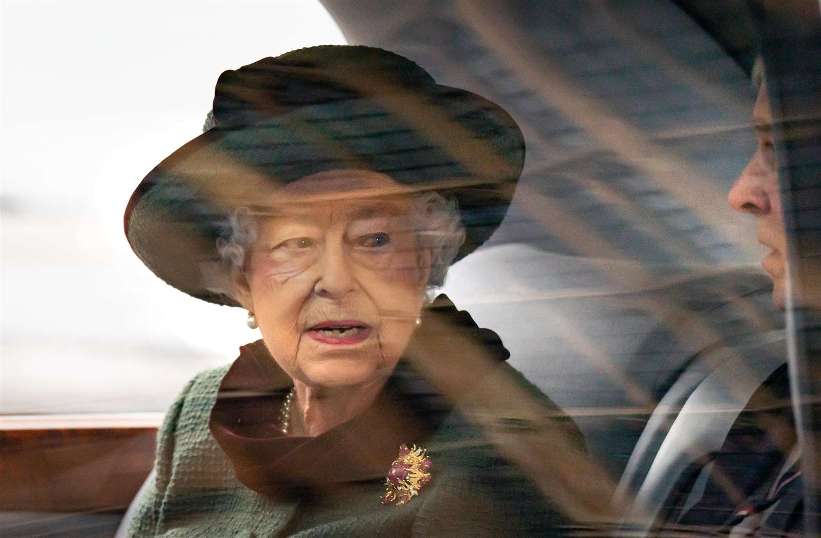 The Queen in green with her scarab brooch given to her by Philip (Aaron Chown/PA)