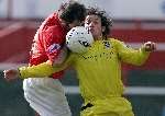 BATTLE: Fleet's Graham Porter and Morecambe's Chris Blackburn compete for the ball. Picture: RICHARD EATON