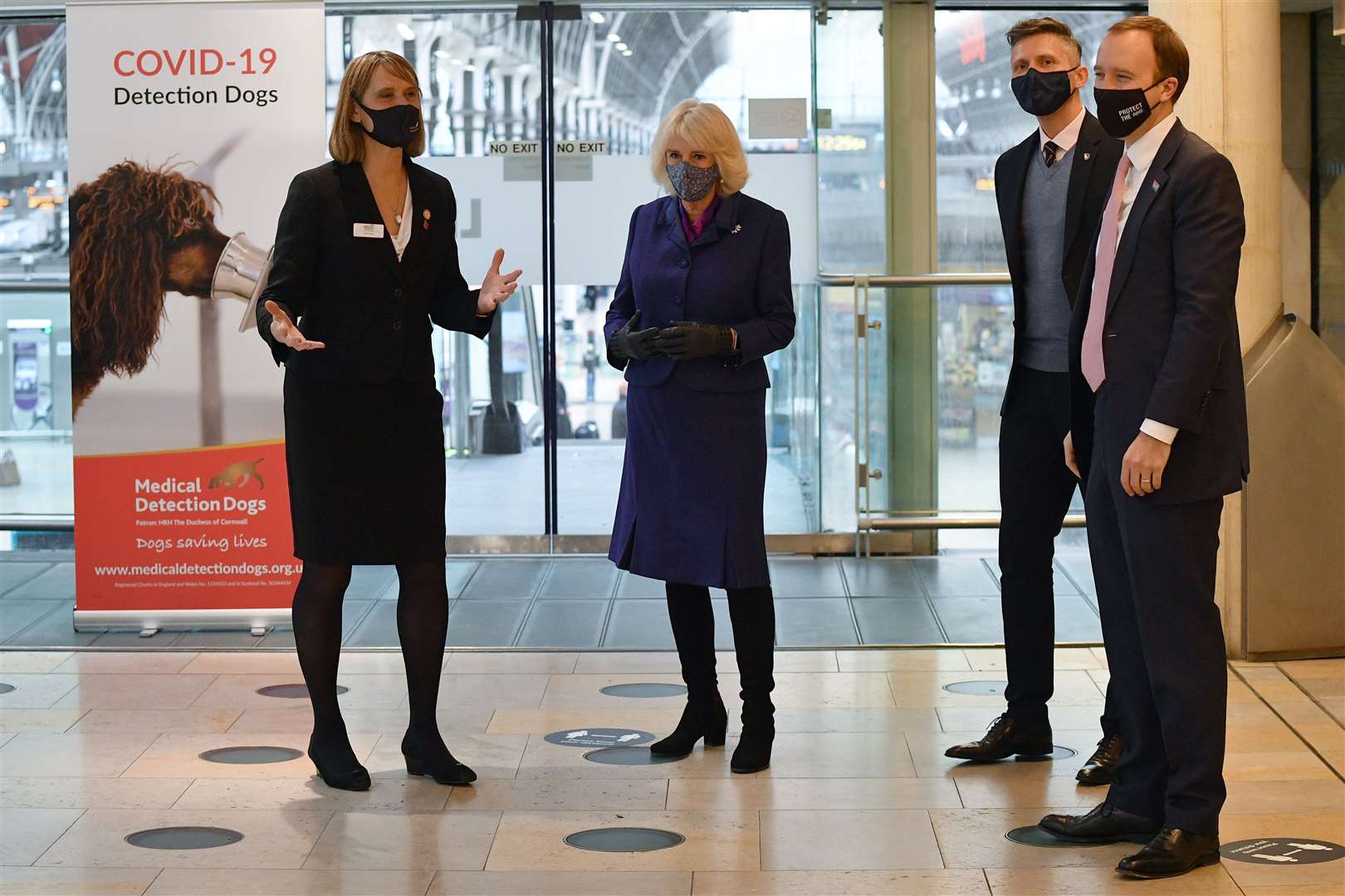 The Duchess of Cornwall and Health Secretary Matt Hancock watch a demonstration by the charity Medical Detection Dogs (Justin Tallis/PA)