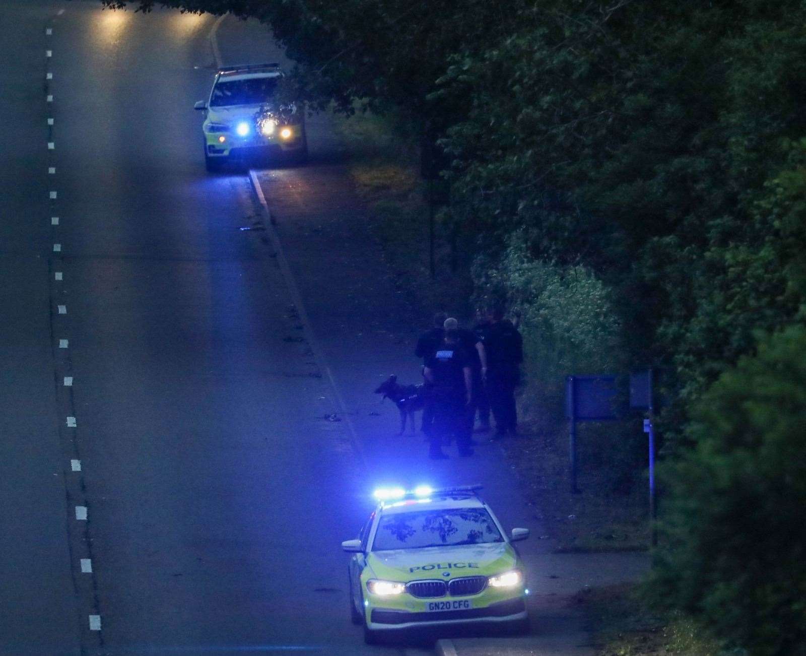 Police were also seen at Chattenden near the Four Elms roundabout in the early hours searching woodland with sniffer dog teams. A police BMW X5 was damaged. Picture: UKNIP