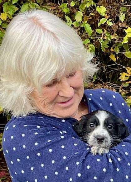 A new owner with her spaniel pup from the Lord Whisky Animal Sanctuary