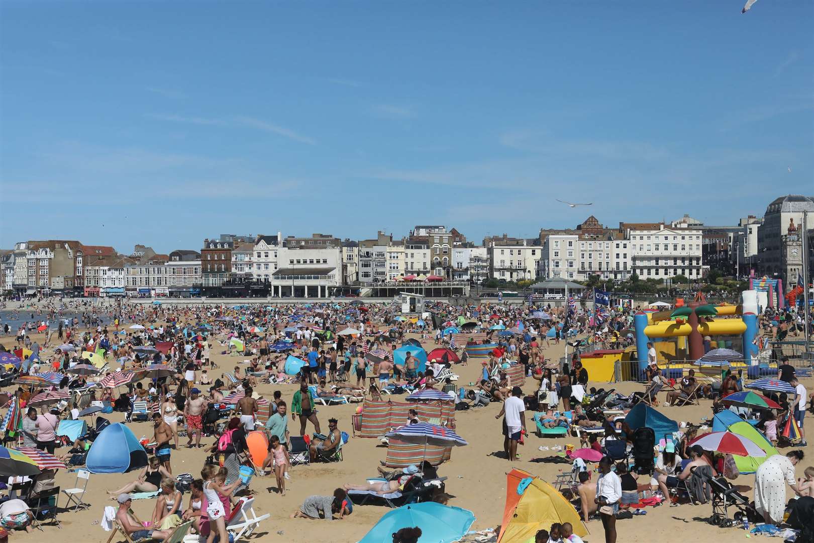 Beach-goers basking in the sun on Sunday on Margate seafront. Picture: UKNIP