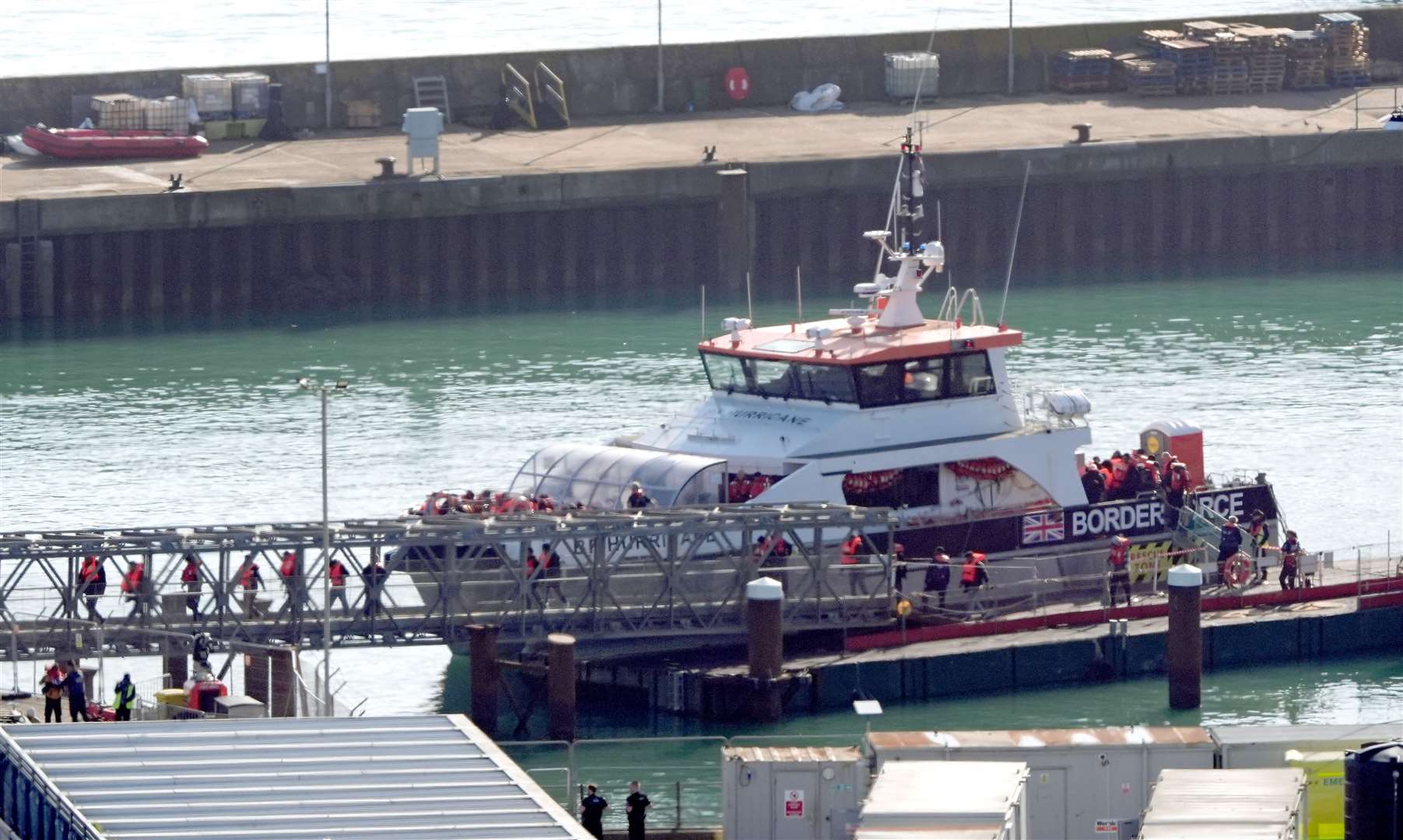 A group of people thought to be migrants are brought in to Dover from a Border Force vessel on Friday (Gareth Fuller/PA)