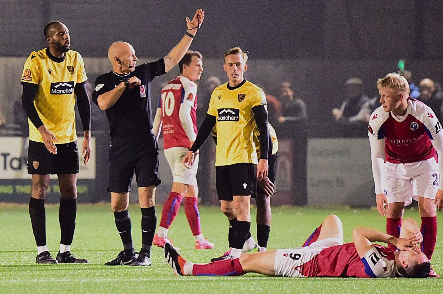 Reiss Greenidge, left, is sent off after catching Dorking forward Jason Prior. Picture: Steve Terrell