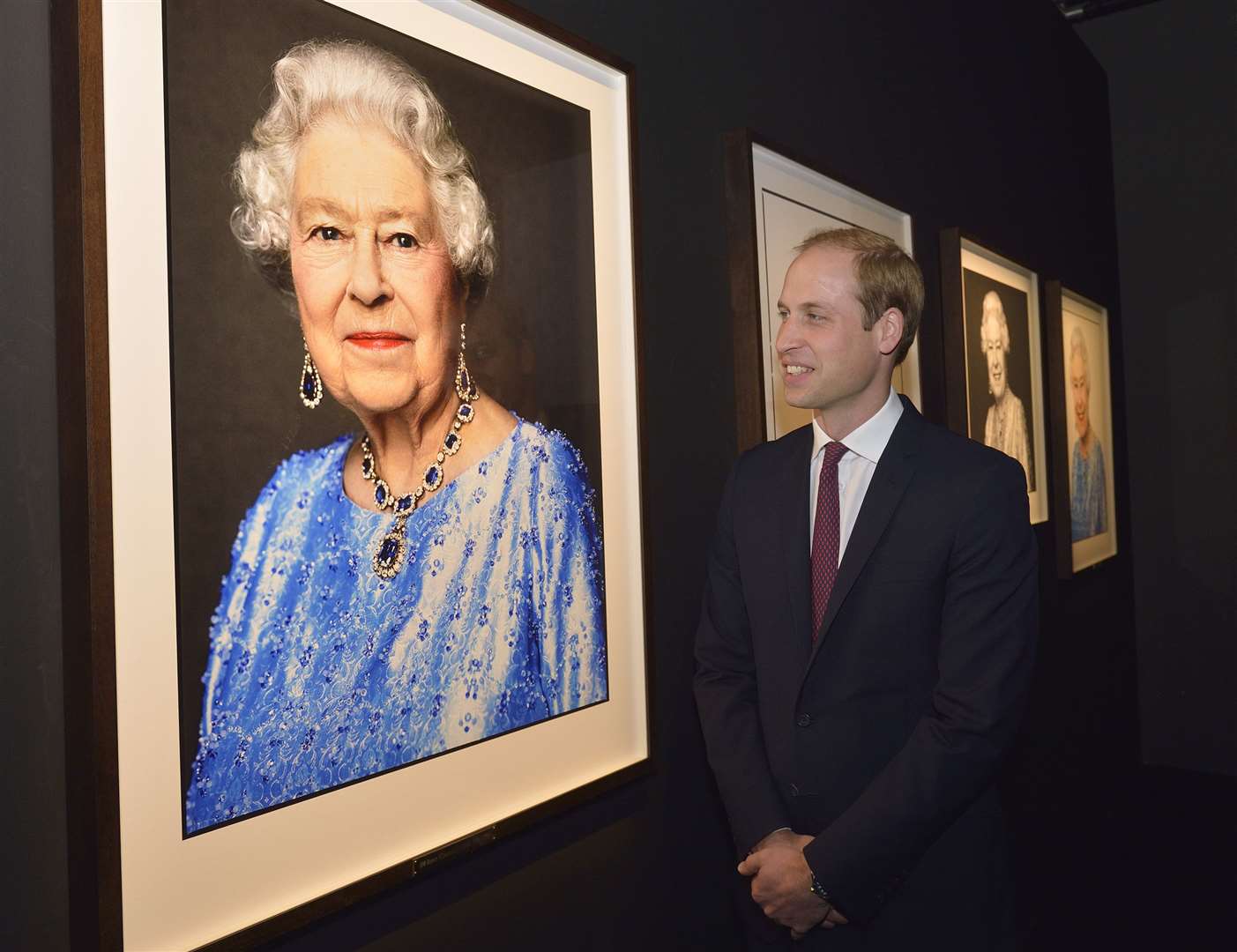 The Duke of Wales looks at David Bailey’s portrait of his grandmother (Arthur Edwards/The Sun/PA)