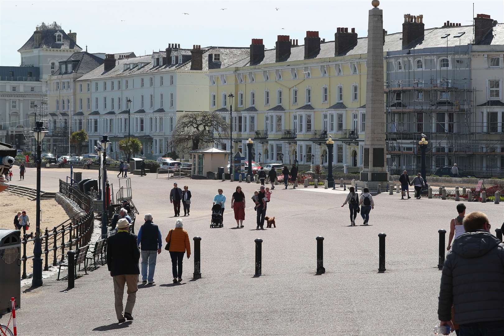 People walk along the promenade in Llandudno (Peter Byrne/PA)