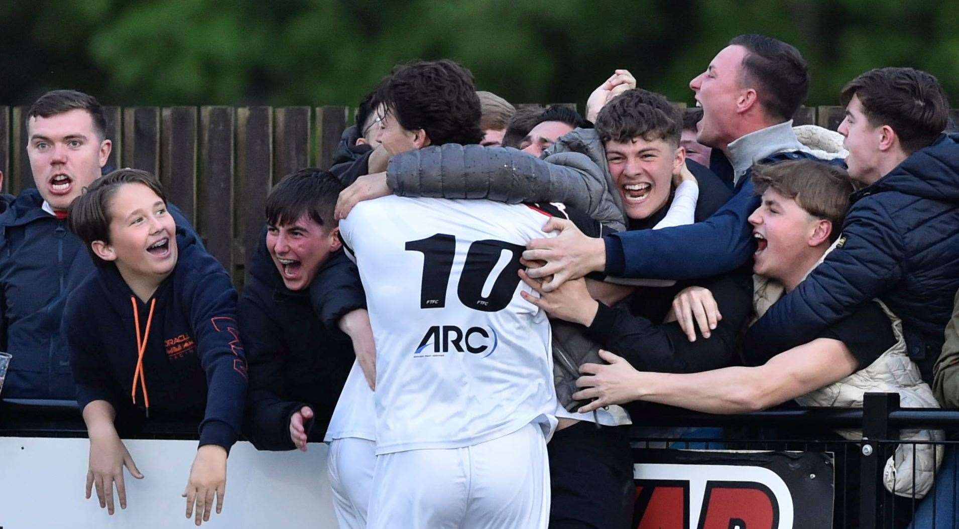 Billy Bennett celebrates a goal for Faversham with fans but they were pegged back twice by Corinthian before a 4-1 defeat on spot-kicks. Picture: Ian Scammell