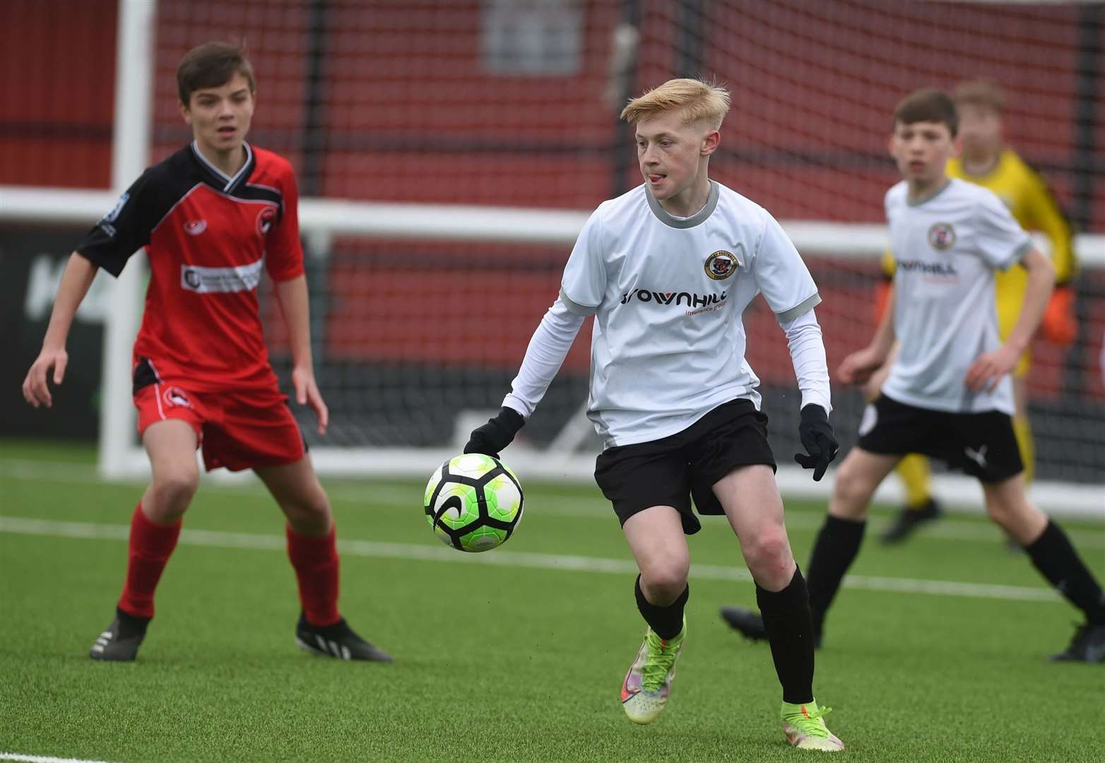 Bromley under-13s (white) on their way to victory in the Kent Merit Under-13 boys cup final. Picture: PSP Images